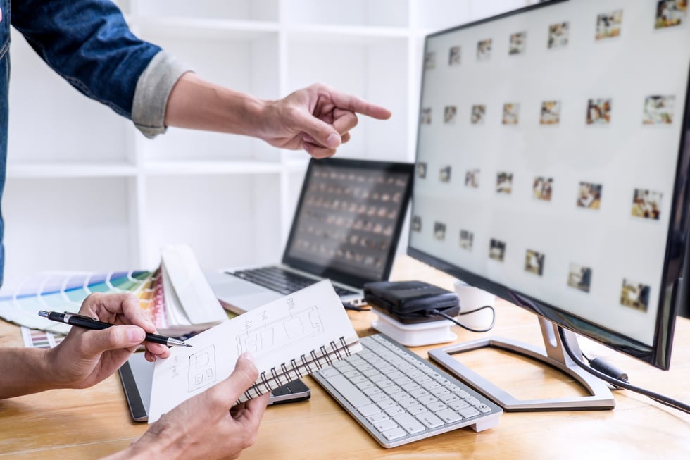 Art Directors Choosing Photos for Project